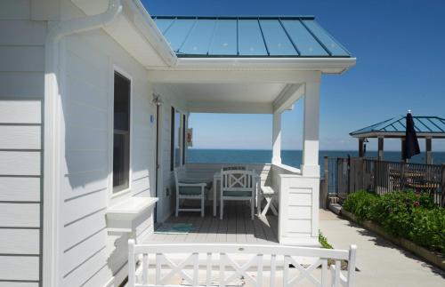 a house with a glass roof on a porch with the ocean at The Montauk Soundview in Montauk
