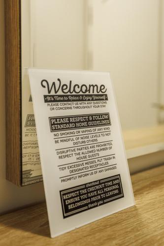 a welcome sign sitting on top of a table at Dosoftei Residence in Chişinău