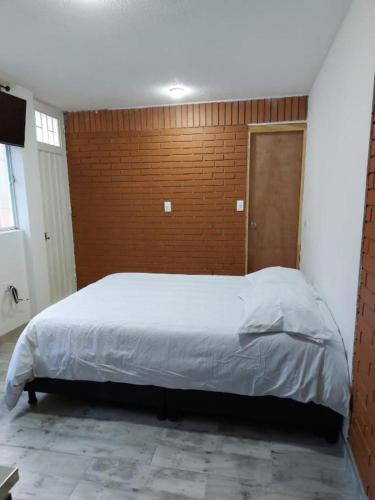 Llit o llits en una habitació de Puesta del sol