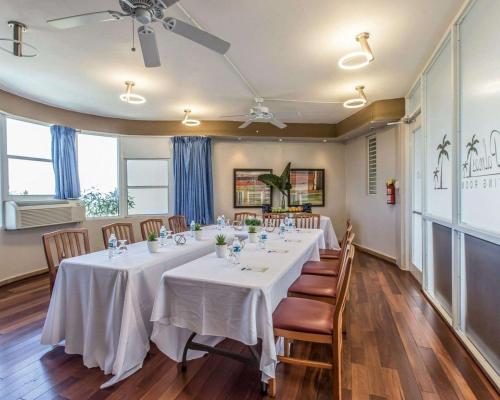 a conference room with a long table with chairs at Comfort Inn & Suites in Levittown