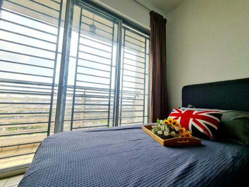 a bedroom with a bed with a tray of flowers on it at Casa SS16 Subang Jaya SJMC Nu Empire Sunway Pyramid Lagoon Sunway Hospital LRT KTM in Subang Jaya