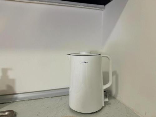 a white blender sitting on a counter in a room at The Ruby - Subang Jaya Edumetro SEGi College in Subang Jaya