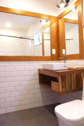 a bathroom with a sink and a mirror at CASA DINIS - Loft - With View Bahia de Portobelo in Portobelo