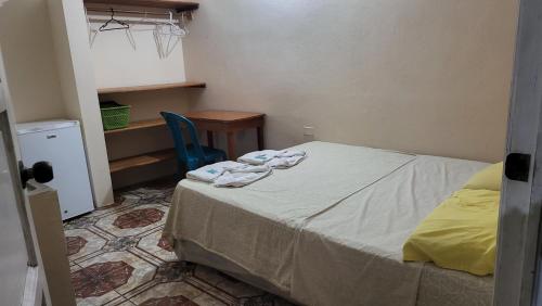 Giường trong phòng chung tại Hospedaje doña Gladys