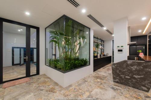 a large aquarium in the middle of a room at Ocean View Luxury Retreat - Private Villa by Nest Group in Nha Trang