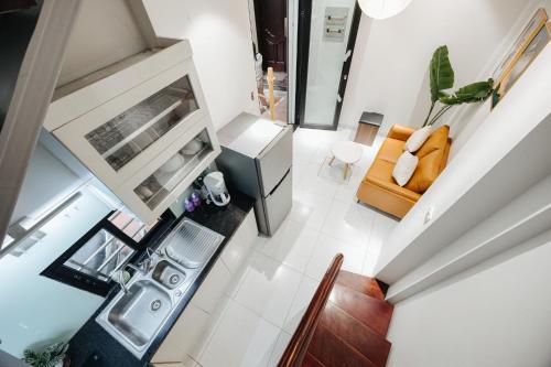 an overhead view of a living room with a couch at 4Brs 20mToHoanKiemLake Central Private OldQuarter in Hanoi