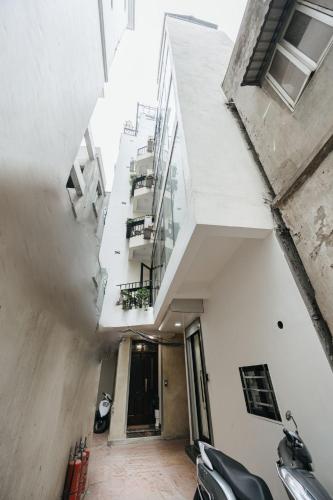 an internal view of an apartment building with a balcony at 4Brs 20mToHoanKiemLake Central Private OldQuarter in Hanoi