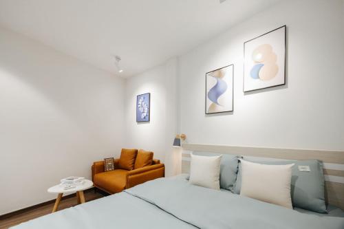 a bedroom with a bed and a chair at 4Brs 20mToHoanKiemLake Central Private OldQuarter in Hanoi