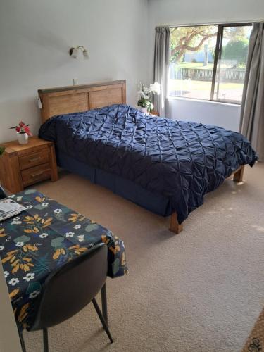 Postel nebo postele na pokoji v ubytování Manly Beach Guest House NZ