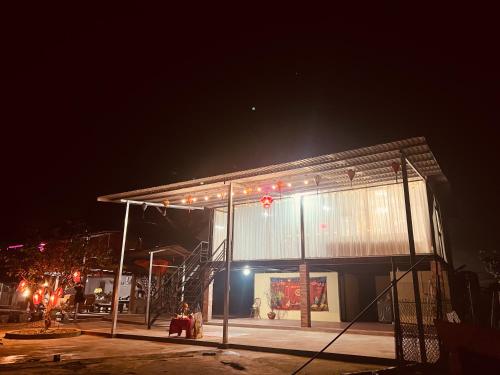 a building at night with lights on it at Fish Farm Homestay in Yên Bái