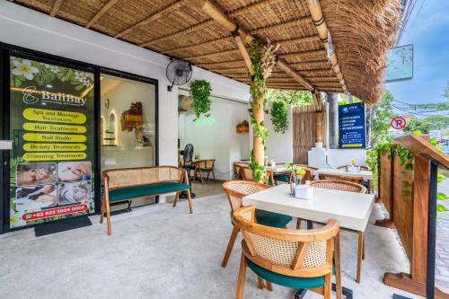a restaurant with a table and chairs in front of it at Bali Bay by Urban Haven in Sanur