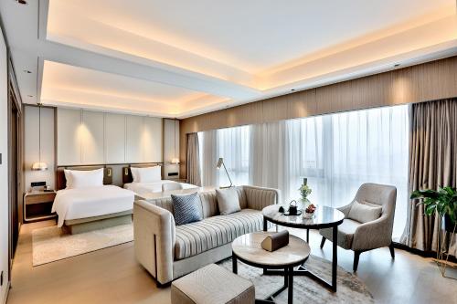 Postel nebo postele na pokoji v ubytování 银都酒店 Yandoo Hotel