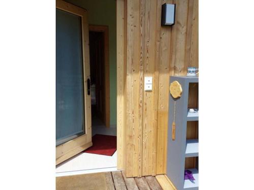 an open door to a room with a refrigerator at Blum - vom Ende Comfortable holiday residence in Altmünster