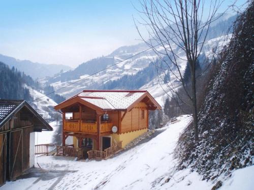 a log cabin in the snow on a mountain at Holiday Home in Grossarl with Mountain Views in Grossarl