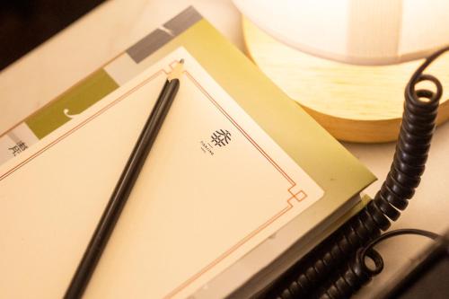 a pair of chopsticks sitting on top of a table at Tian Jing Hotel in Kuala Lumpur