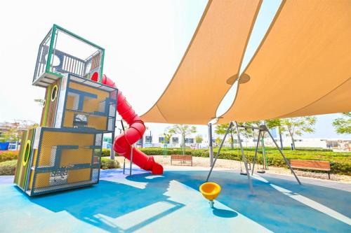 a playground with a slide at Luxury Apt Burj Khalifa, Sunset and Lagoon view in Dubai