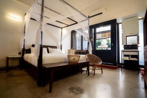 Postel nebo postele na pokoji v ubytování Tian Jing Hotel
