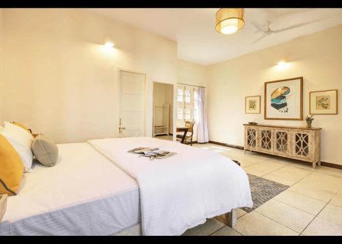 Кровать или кровати в номере Avaanti Boutique Stays By Avaanti Stays