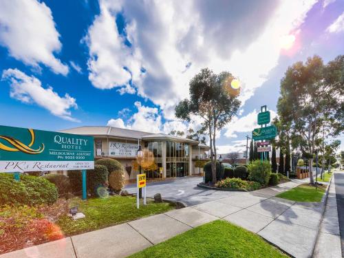 a building with a sign in front of it at Quality Hotel Melbourne Airport in Melbourne