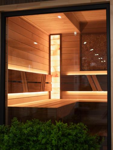 a room with a wooden wall and a window at Dynasty Hotel & SPA in Yerevan
