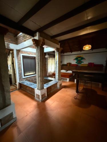 a living room with a television and a table at Annapara Homestay in Vythiri - Wayanad in Vythiri