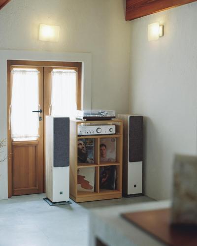 a kitchen with a stove and speakers in a room at Portside Inn Hakodate in Hakodate