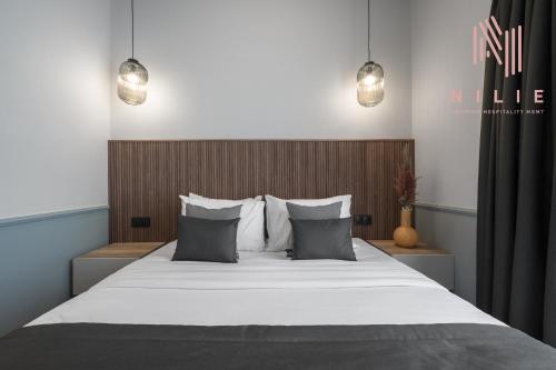 Katil atau katil-katil dalam bilik di Esther Suites, Nilie Hospitality MGMT