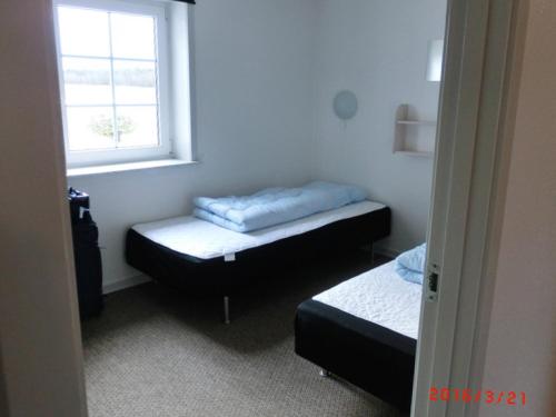 Letto o letti in una camera di Langelund Apartments
