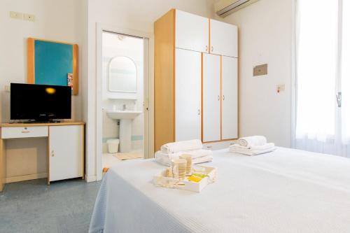 TV a/nebo společenská místnost v ubytování Hotel Lucciola