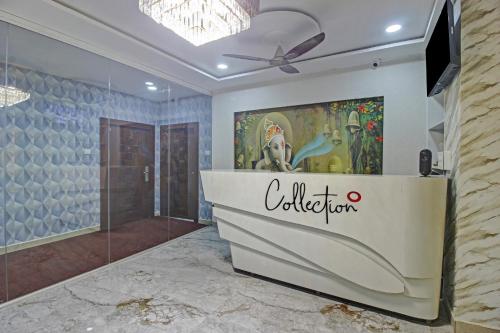 a bathroom with a shower and a wall with a cffler sign at Super Collection O Vinayaka Luxury Stays in Warangal