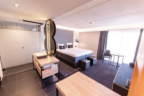 Postel nebo postele na pokoji v ubytování Gr8 Hotel Sevenum