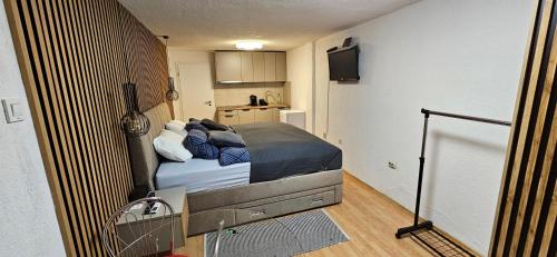 a bedroom with a bed in a small room at Studio apartment Lovrekovic in Zagreb