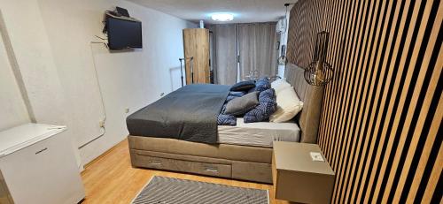 a bedroom with a bed in a small room at Studio apartment Lovrekovic in Zagreb
