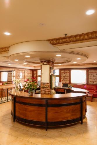 a lobby with a reception desk in a building at Hotel Polamar in Santa Pola