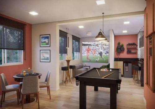 a living room with a ping pong table in it at FLAT NOVO 2 QUARTOS, 5MIN ZOO SAFARi JARDIM BOTÂNICO in Sao Paulo