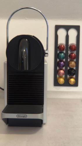a toaster sitting on a counter next to a box of donuts at ARYVE Boutique-Apartments in bester Lage in Bad Hersfeld in Bad Hersfeld