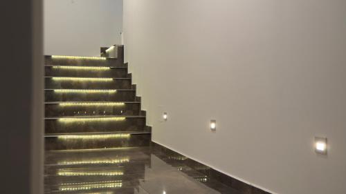 an escalator with gold steps in a building at ARYVE Boutique-Apartments in bester Lage in Bad Hersfeld in Bad Hersfeld