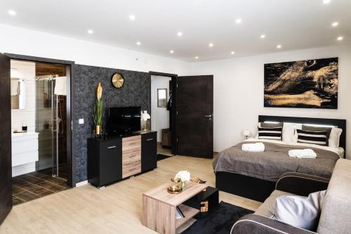 Postel nebo postele na pokoji v ubytování S&M Apartman Nagykőrös