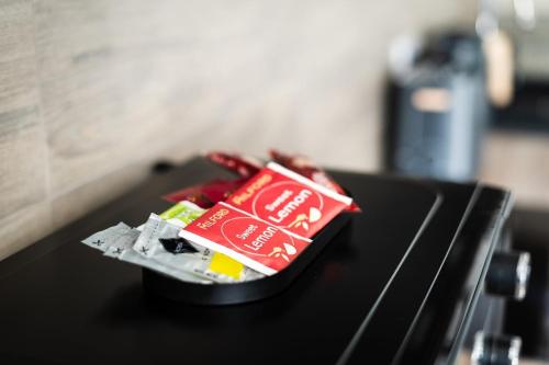 a container of food sitting on top of a stove at S&M Apartman Nagykőrös in Nagykőrös