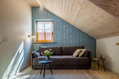 a living room with a couch and a window at B2 Apartments in Klaipėda