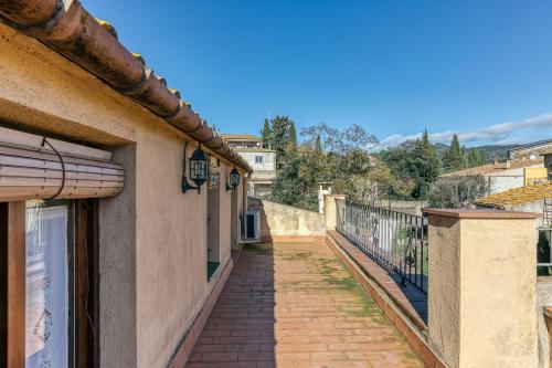 a balcony of a building with a walkway at Cal Matalí in Espolla