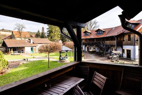 a view from the porch of a house with a bench at Landkulturhof Glücksbringer in Rudolstadt