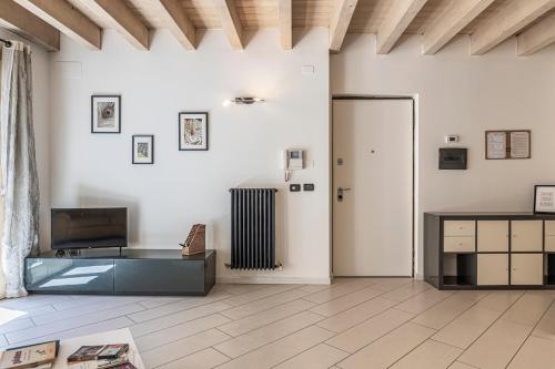 a living room with a glass table and a door at Barbudo's House in Lonato del Garda