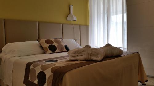 Postel nebo postele na pokoji v ubytování HOTEL TRIONFAL - Fronte Mare - Vicinissimi al Centro