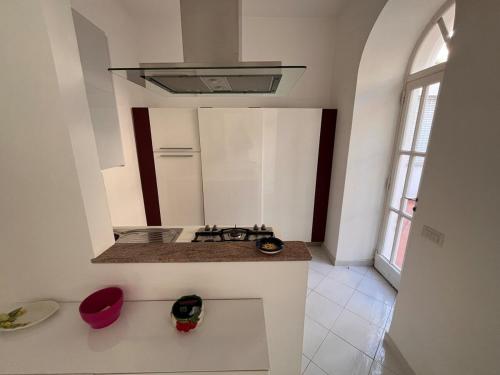 a kitchen with a sink and a stove top oven at Apartment in Villa Argentina in Capri