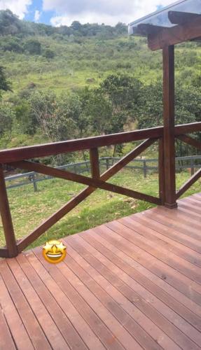 a wooden deck with a yellow item on it at Loft do Lessa in Ouro Preto