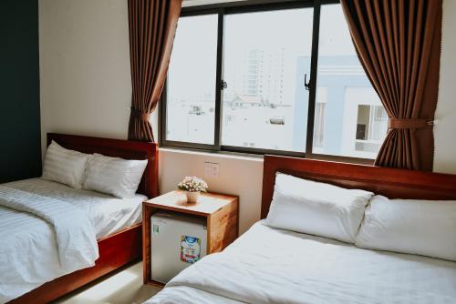 Postel nebo postele na pokoji v ubytování Talofofo Hostel