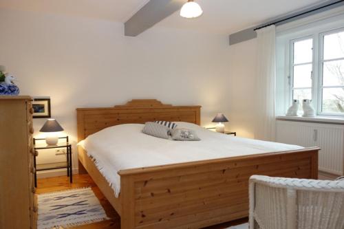 Katil atau katil-katil dalam bilik di Ferienhaus Süderende 50