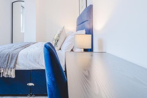 Ένα ή περισσότερα κρεβάτια σε δωμάτιο στο The Regent Circus Apartments