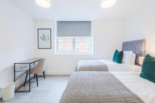 Ένα ή περισσότερα κρεβάτια σε δωμάτιο στο The Regent Circus Apartments